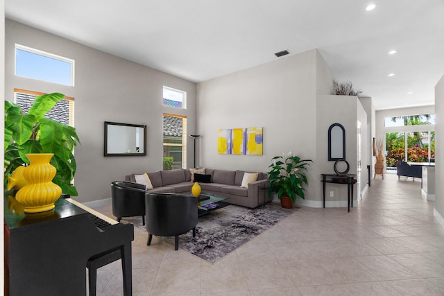 19699 Dinner Key Dr, Boca Raton, FL 33498 - living room featuring recessed lighting, visible vents, baseboards, and a high ceiling