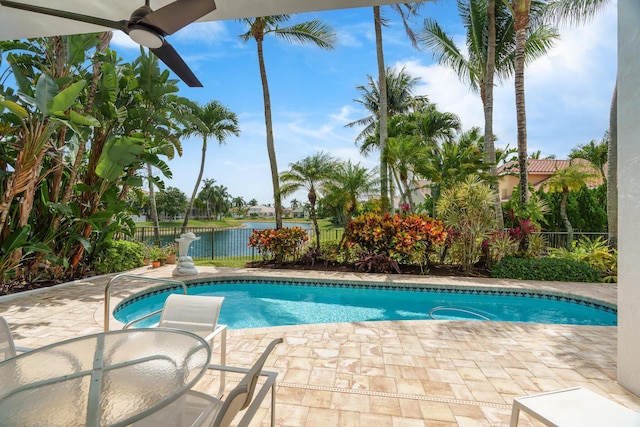 19699 Dinner Key Dr, Boca Raton, FL 33498 - view of pool with a water view, a fenced backyard, a patio, a fenced in pool, and ceiling fan
