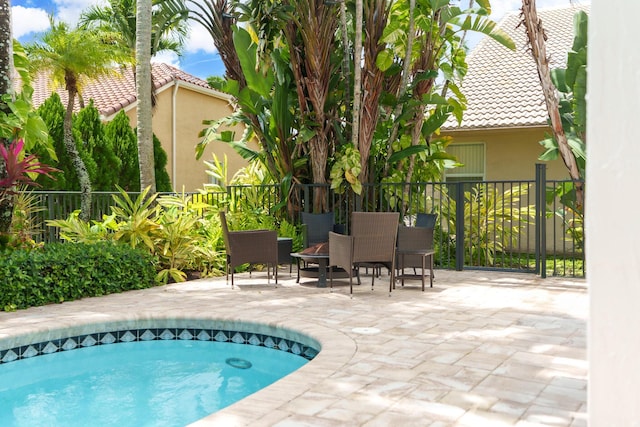 19699 Dinner Key Dr, Boca Raton, FL 33498 - view of swimming pool featuring a swimming pool, a patio, and fence