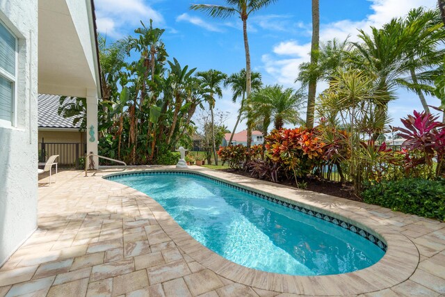 19699 Dinner Key Dr, Boca Raton, FL 33498 - outdoor pool featuring a patio and fence
