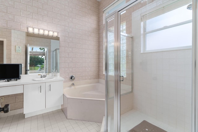 19699 Dinner Key Dr, Boca Raton, FL 33498 - bathroom with a garden tub, a stall shower, vanity, tile walls, and tile patterned flooring
