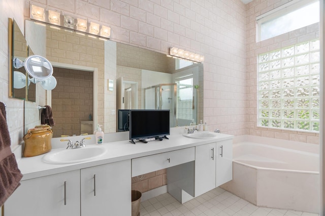 19699 Dinner Key Dr, Boca Raton, FL 33498 - bathroom featuring a shower stall, tile walls, tile patterned flooring, and a sink
