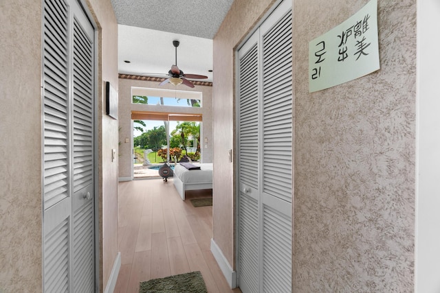 19699 Dinner Key Dr, Boca Raton, FL 33498 - hallway featuring baseboards and wood finished floors