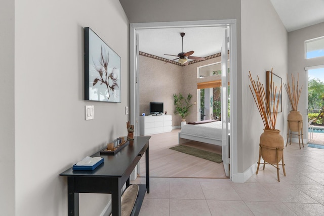 19699 Dinner Key Dr, Boca Raton, FL 33498 - entrance foyer with a ceiling fan, baseboards, and light tile patterned floors
