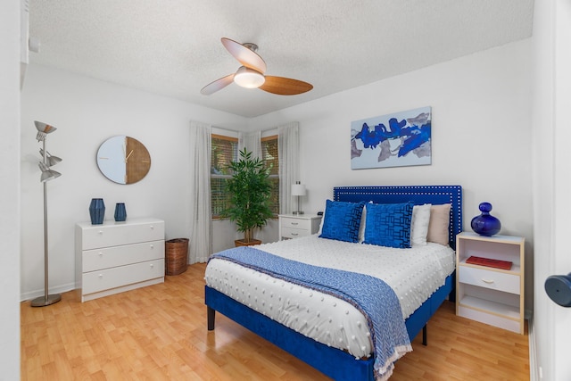 19699 Dinner Key Dr, Boca Raton, FL 33498 - bedroom with wood finished floors, a textured ceiling, and a ceiling fan