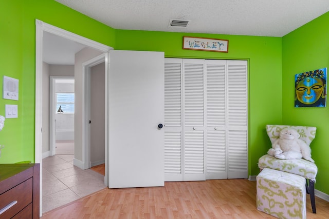19699 Dinner Key Dr, Boca Raton, FL 33498 - interior space featuring light wood-style flooring, a closet, baseboards, and visible vents