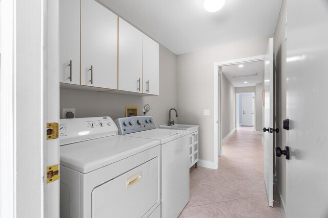 19699 Dinner Key Dr, Boca Raton, FL 33498 - laundry area featuring a sink, light tile patterned floors, cabinet space, baseboards, and independent washer and dryer