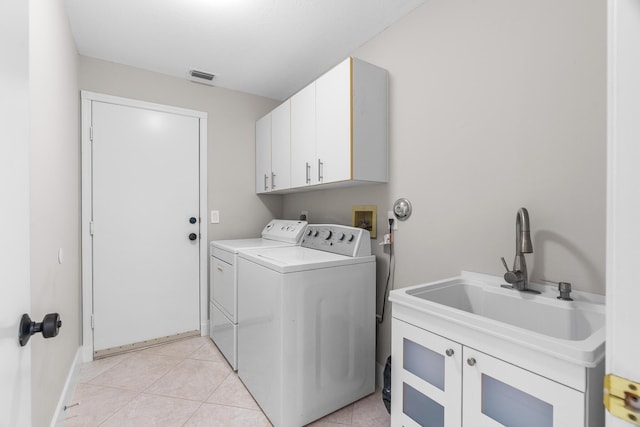 19699 Dinner Key Dr, Boca Raton, FL 33498 - clothes washing area featuring a sink, separate washer and dryer, light tile patterned floors, cabinet space, and visible vents