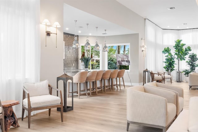 19699 Dinner Key Dr, Boca Raton, FL 33498 - interior space with bar, recessed lighting, visible vents, and light wood-style flooring