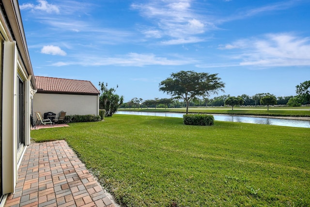 8326 Mooring Cir, Boynton Beach, FL 33472 - view of green lawn with a water view and a patio