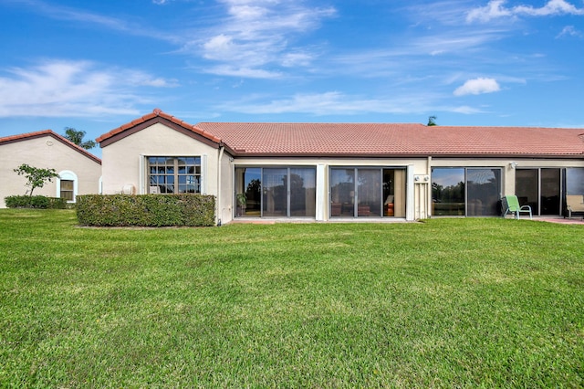 8326 Mooring Cir, Boynton Beach, FL 33472 - rear view of property featuring a tile roof, a lawn, and stucco siding