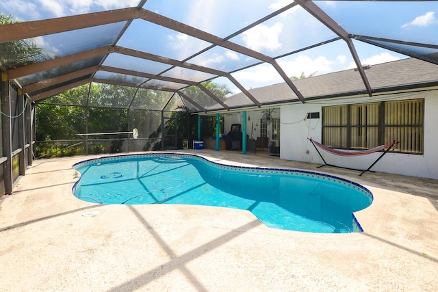 pool featuring a lanai and a patio area