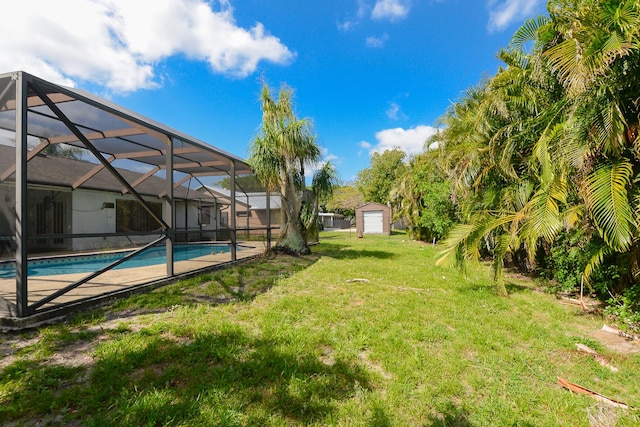 view of yard with an outdoor pool and glass enclosure