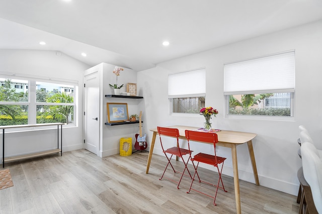 135 NE 11th Ave, Boynton Beach, FL 33435 - dining space featuring healthy amount of natural light, baseboards, wood finished floors, lofted ceiling, and recessed lighting