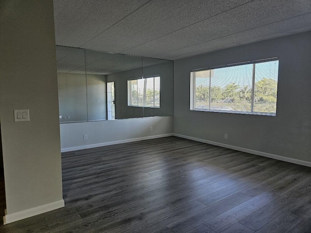 300 Village Green Cir S Unit 206, Palm Springs, FL 33461 - empty room featuring baseboards and dark wood-style floors
