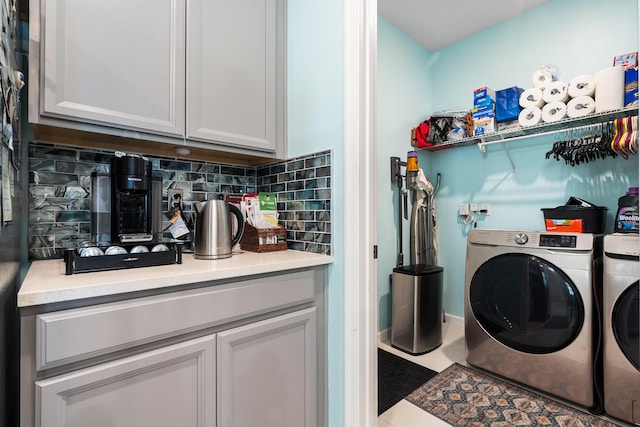 1908 Harding St, Lake Worth, FL 33460 - laundry area featuring washing machine and clothes dryer and cabinet space