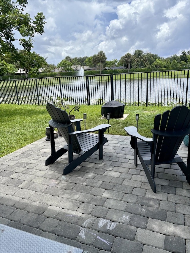 1908 Harding St, Lake Worth, FL 33460 - view of patio / terrace with a water view