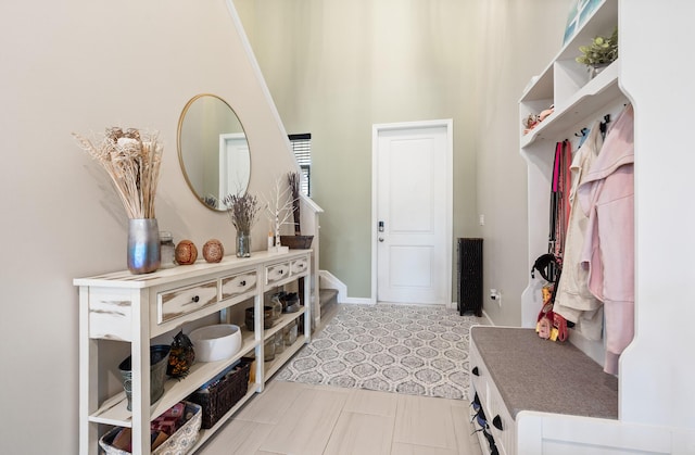 1908 Harding St, Lake Worth, FL 33460 - mudroom featuring tile patterned floors and a towering ceiling