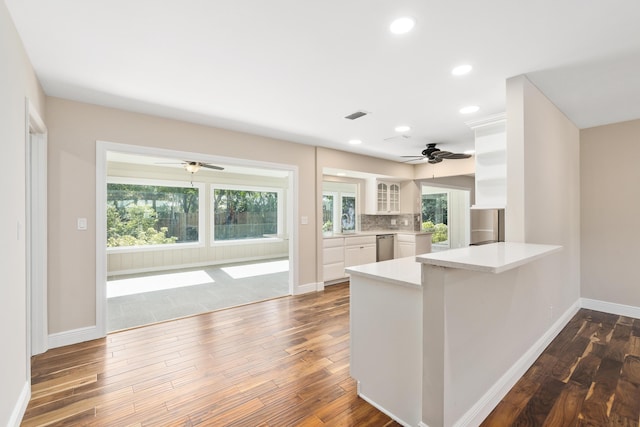 7 Riverview Dr, Sewalls Point, FL 34996 - kitchen featuring white cabinets, plenty of natural light, dark wood-type flooring, and ceiling fan