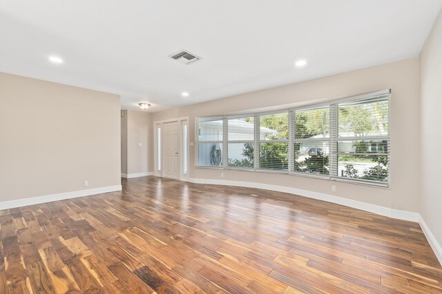 7 Riverview Dr, Sewalls Point, FL 34996 - empty room featuring visible vents, baseboards, recessed lighting, and wood finished floors