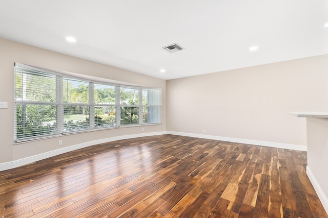 7 Riverview Dr, Sewalls Point, FL 34996 - spare room featuring visible vents, baseboards, recessed lighting, and dark wood-style floors