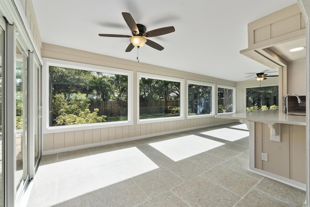 7 Riverview Dr, Sewalls Point, FL 34996 - unfurnished sunroom featuring a sink and a ceiling fan