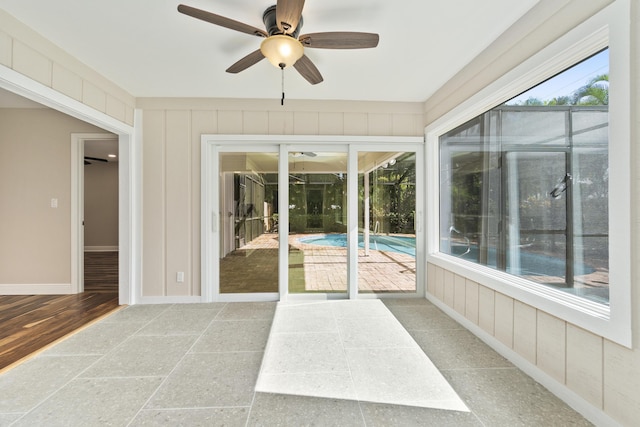 7 Riverview Dr, Sewalls Point, FL 34996 - unfurnished sunroom featuring a ceiling fan