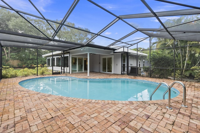 7 Riverview Dr, Sewalls Point, FL 34996 - pool with a patio area and glass enclosure