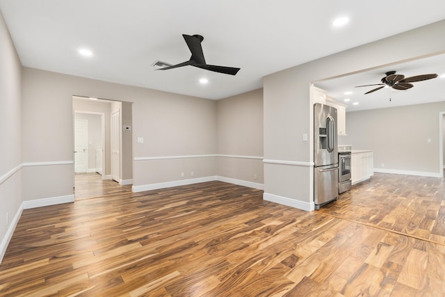 7 Riverview Dr, Sewalls Point, FL 34996 - unfurnished living room with visible vents, recessed lighting, a ceiling fan, and wood finished floors