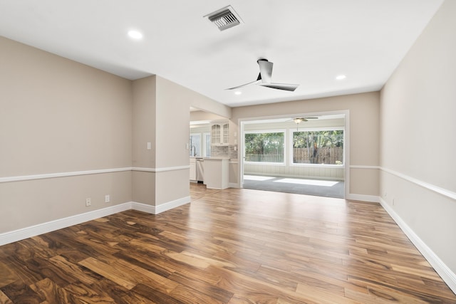 7 Riverview Dr, Sewalls Point, FL 34996 - spare room featuring baseboards, recessed lighting, visible vents, ceiling fan, and wood finished floors