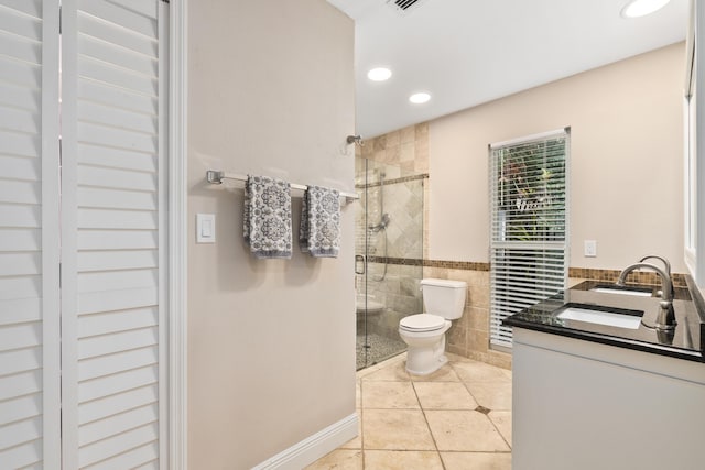 7 Riverview Dr, Sewalls Point, FL 34996 - bathroom featuring tile patterned floors, toilet, a shower stall, and tile walls