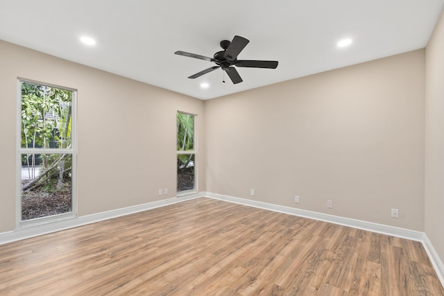 7 Riverview Dr, Sewalls Point, FL 34996 - spare room with light wood-type flooring, baseboards, a ceiling fan, and recessed lighting