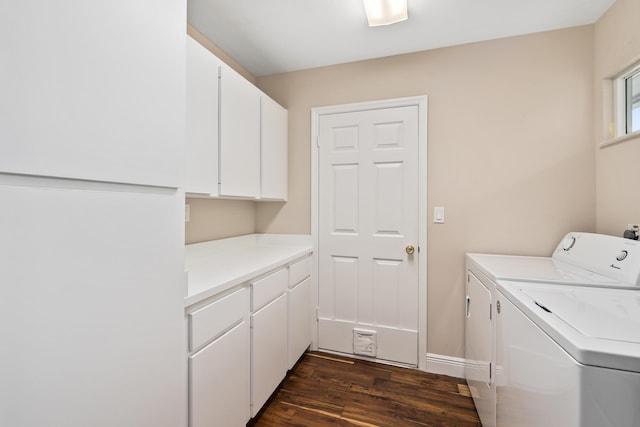 7 Riverview Dr, Sewalls Point, FL 34996 - washroom featuring washing machine and clothes dryer, baseboards, dark wood-style floors, and cabinet space