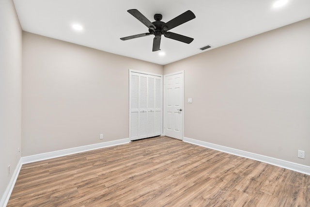 7 Riverview Dr, Sewalls Point, FL 34996 - unfurnished bedroom with a closet, visible vents, baseboards, and wood finished floors