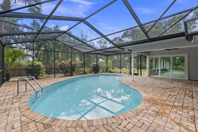 7 Riverview Dr, Sewalls Point, FL 34996 - outdoor pool featuring a patio and glass enclosure