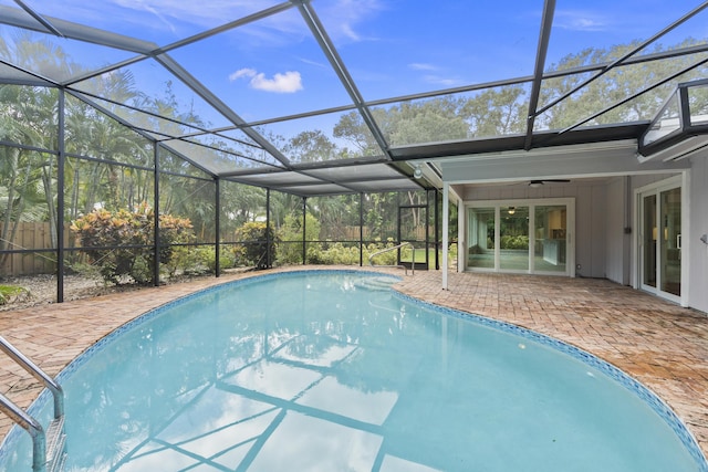 7 Riverview Dr, Sewalls Point, FL 34996 - pool with a patio area, ceiling fan, fence, and glass enclosure