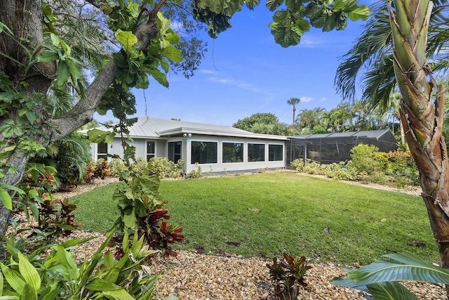 7 Riverview Dr, Sewalls Point, FL 34996 - view of yard featuring glass enclosure