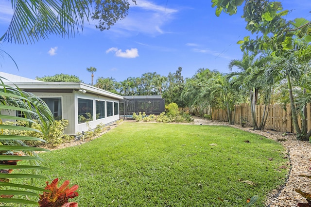 7 Riverview Dr, Sewalls Point, FL 34996 - view of yard featuring a lanai and fence