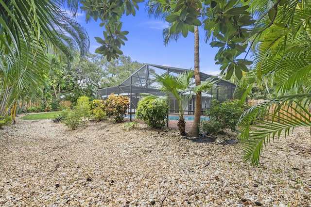7 Riverview Dr, Sewalls Point, FL 34996 - view of property exterior with an outdoor pool and glass enclosure