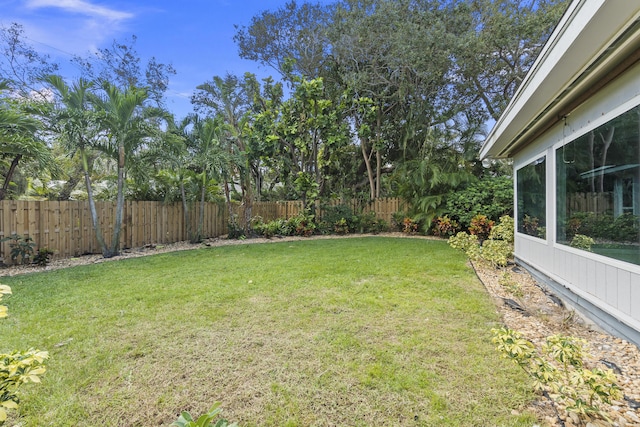 7 Riverview Dr, Sewalls Point, FL 34996 - view of yard with fence and a sunroom