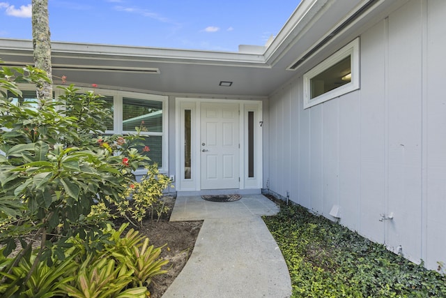 7 Riverview Dr, Sewalls Point, FL 34996 - view of exterior entry featuring board and batten siding