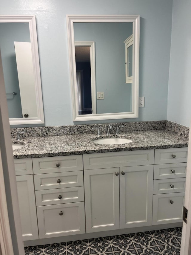 full bath featuring double vanity and a sink