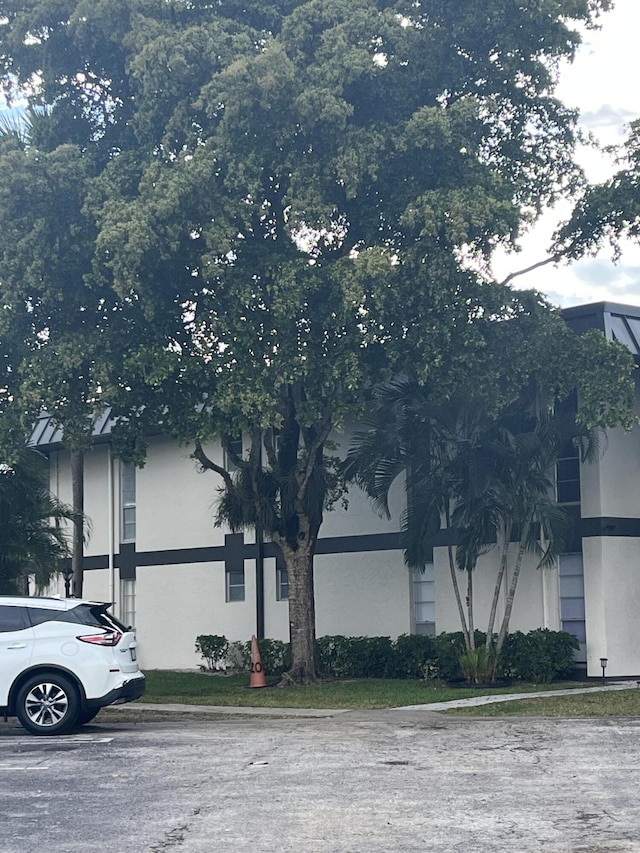 view of side of property featuring stucco siding