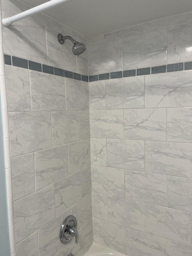 full bathroom with shower / bath combination