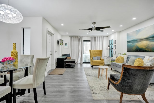 1013 Green Pine Blvd Unit A1, West Palm Beach, FL 33409 - living area featuring recessed lighting, a chandelier, wood finished floors, and a ceiling fan