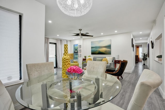 1013 Green Pine Blvd Unit A1, West Palm Beach, FL 33409 - dining room with healthy amount of natural light, wood finished floors, a chandelier, recessed lighting, and a ceiling fan