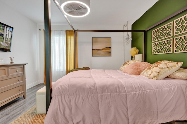 1013 Green Pine Blvd Unit A1, West Palm Beach, FL 33409 - bedroom featuring wood finished floors and baseboards
