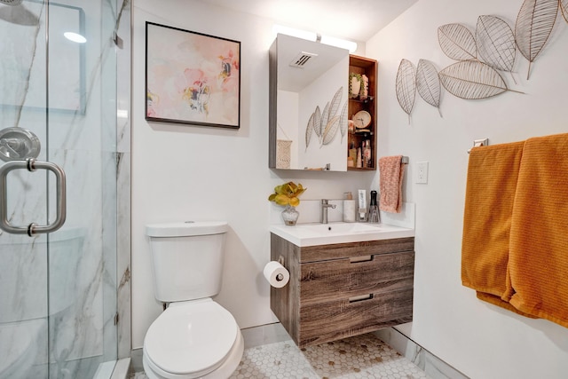 1013 Green Pine Blvd Unit A1, West Palm Beach, FL 33409 - full bath with a marble finish shower, tile patterned flooring, vanity, toilet, and baseboards