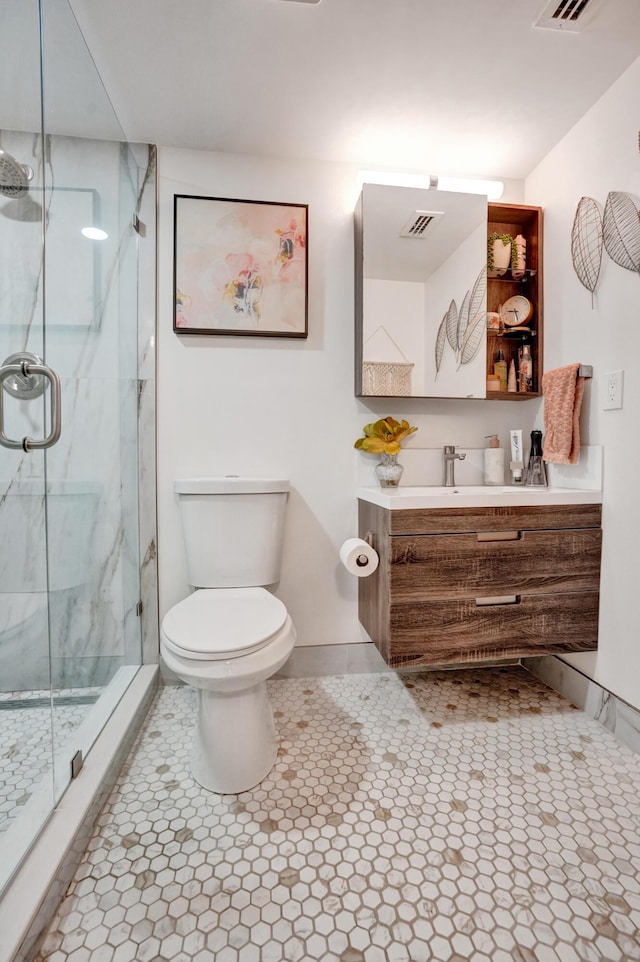 1013 Green Pine Blvd Unit A1, West Palm Beach, FL 33409 - bathroom with toilet, a marble finish shower, tile patterned floors, and vanity
