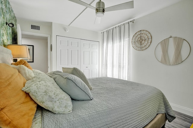 1013 Green Pine Blvd Unit A1, West Palm Beach, FL 33409 - bedroom featuring a closet, baseboards, wood finished floors, and a ceiling fan